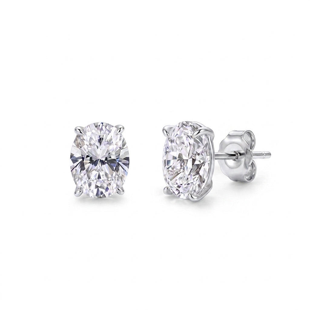 10k white gold 8x13mm oval cut lab-grown diamond stud engagement earrings pair on white studio background