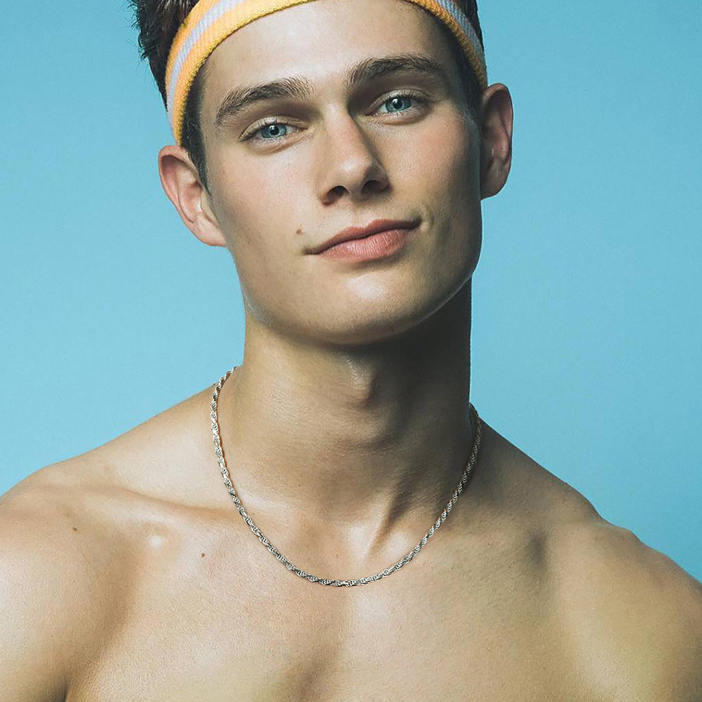 Male model wearing the necklace alone on bare skin or with a casual shirt.