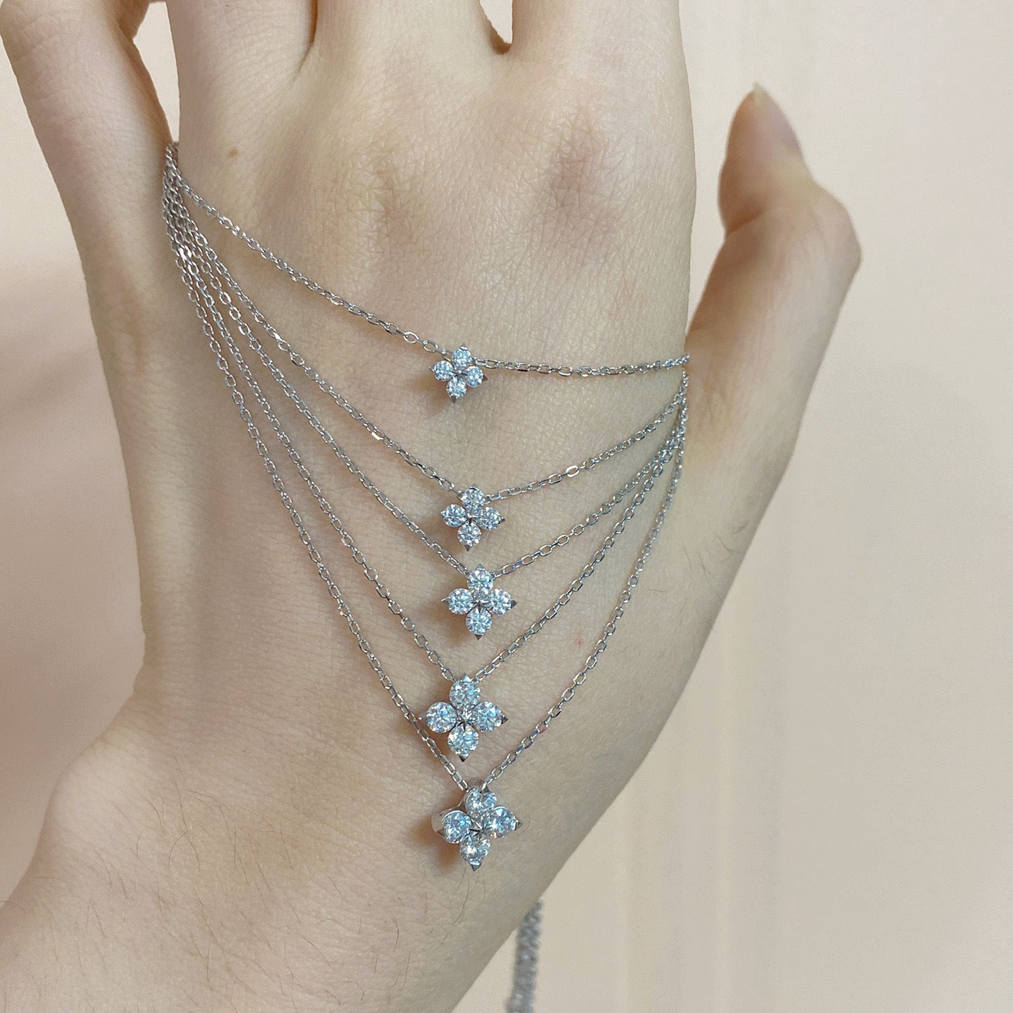 Clover pendant on soft green or cream background. Alt: “14K Gold-Plated Moissanite Four-Leaf Clover Necklace.”