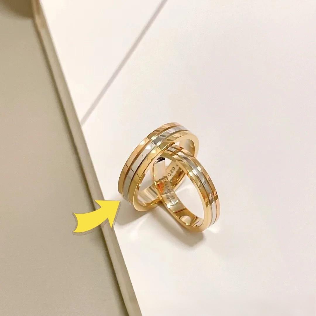 18K Gold-Plated Sterling Silver Couple Rings Small sizeTwo gold rings on a light background with a yellow arrow pointing to one of them.