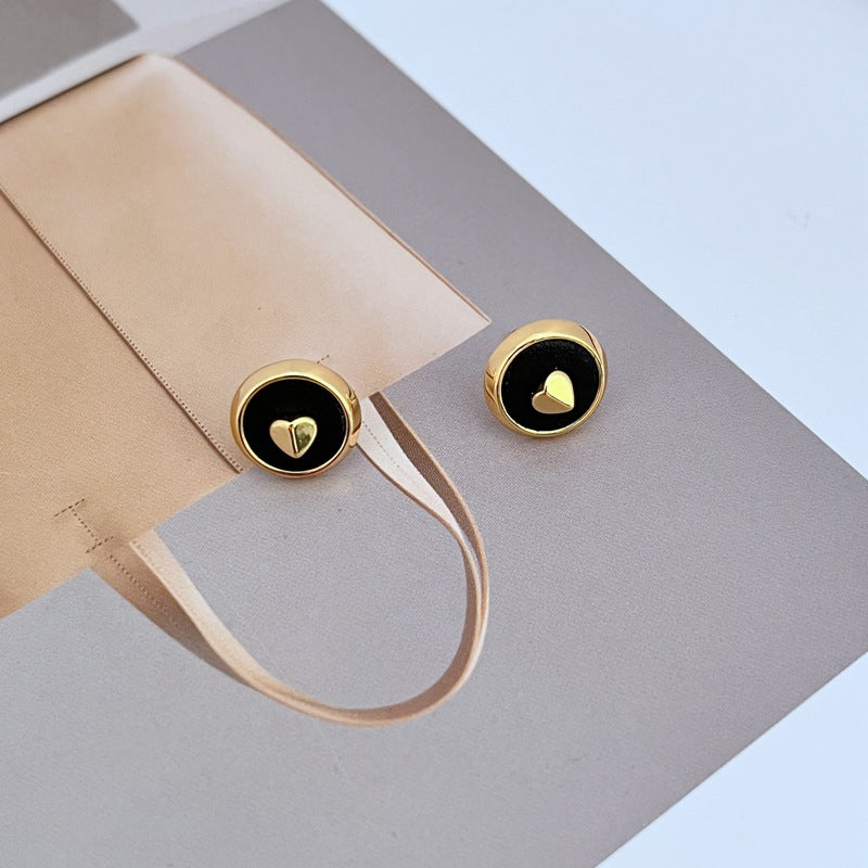 Assortment of heart spacer beads displayed on a clean white background, showcasing the glossy enamel colors and gold-filled rims. Alt: “18K Gold Filled Heart Spacer Beads – Enamel Love Beads for Women.”