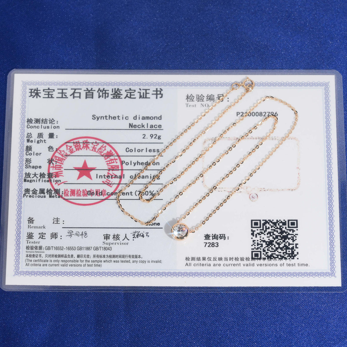 18k rose gold 5mm bezel-set solitaire lab-grown diamond pendant necklace displayed with jewelry certificate