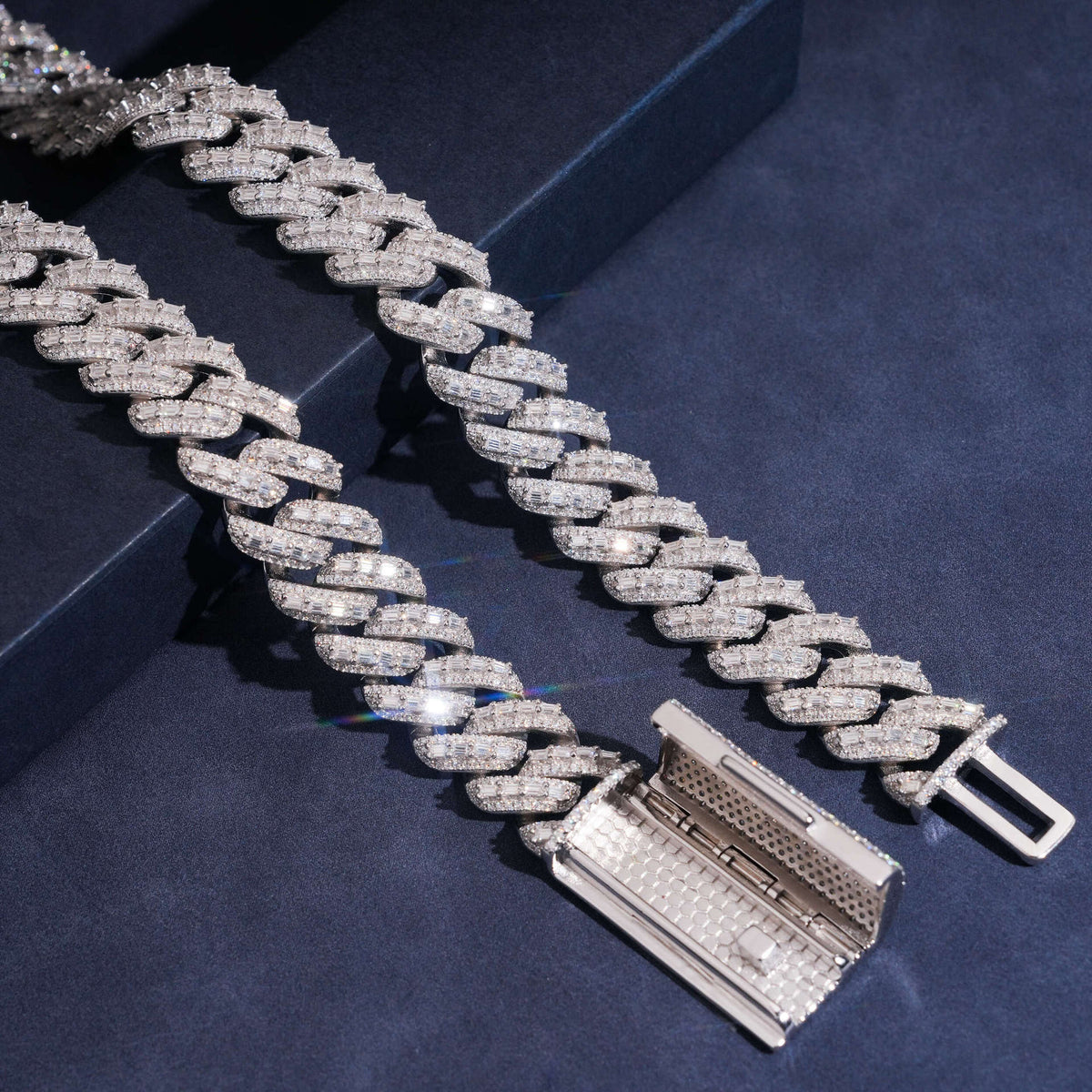 Close-up of heavy-duty box clasp with double safety, showing reinforced construction for extreme weight.