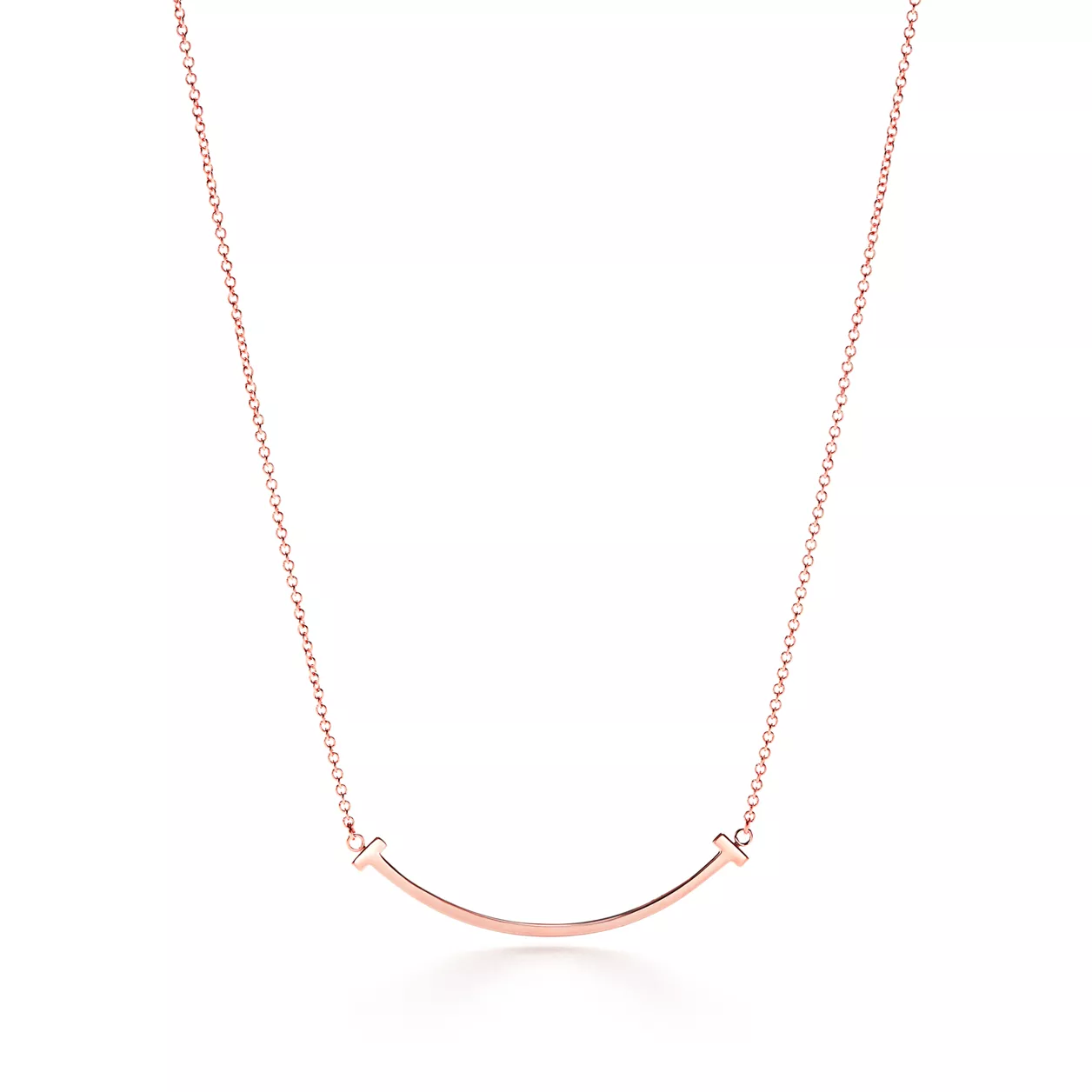 Small Tiffany T Smile Pendant necklace by Zerra Jewelry featuring a delicate gold T-shaped charm on a fine chain.