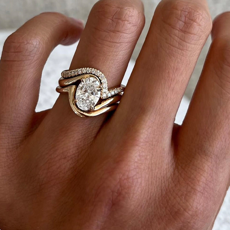 Yellow gold oval stacking set on neutral background. Alt: “2.5CT Oval Diamond Stacking Ring Set – 18K Yellow Gold.”