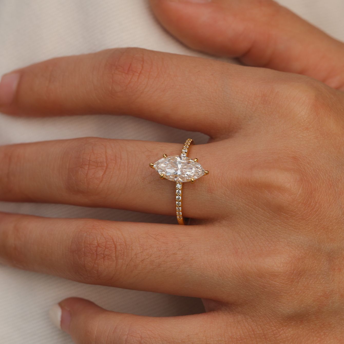 Ring worn as dramatic engagement ring. Alt: “Dramatic Elegance: 2CT Marquise Moissanite Ring.”