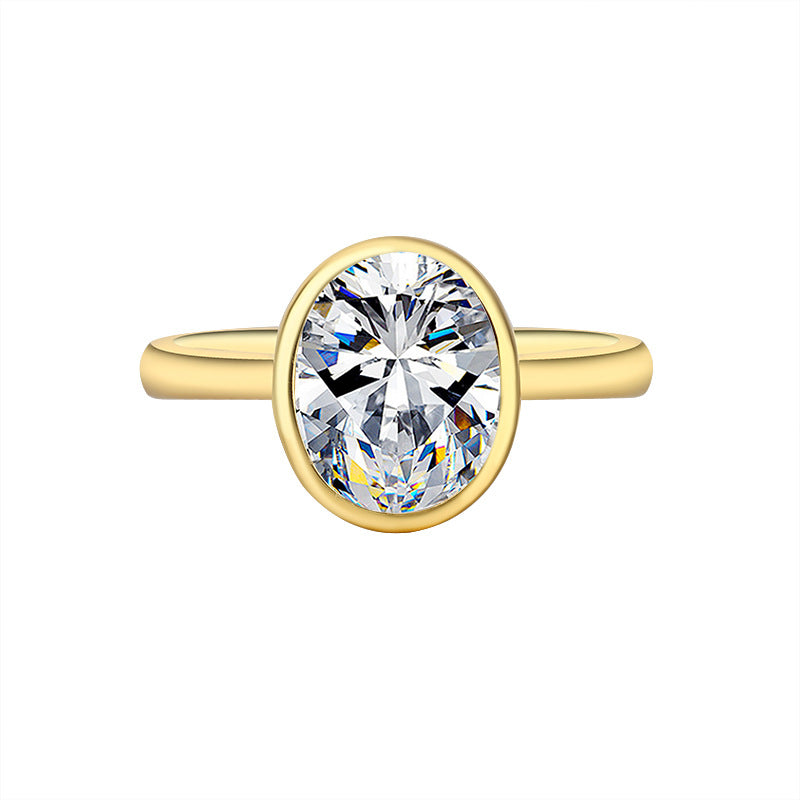 Gold ring with a large diamond on a white background