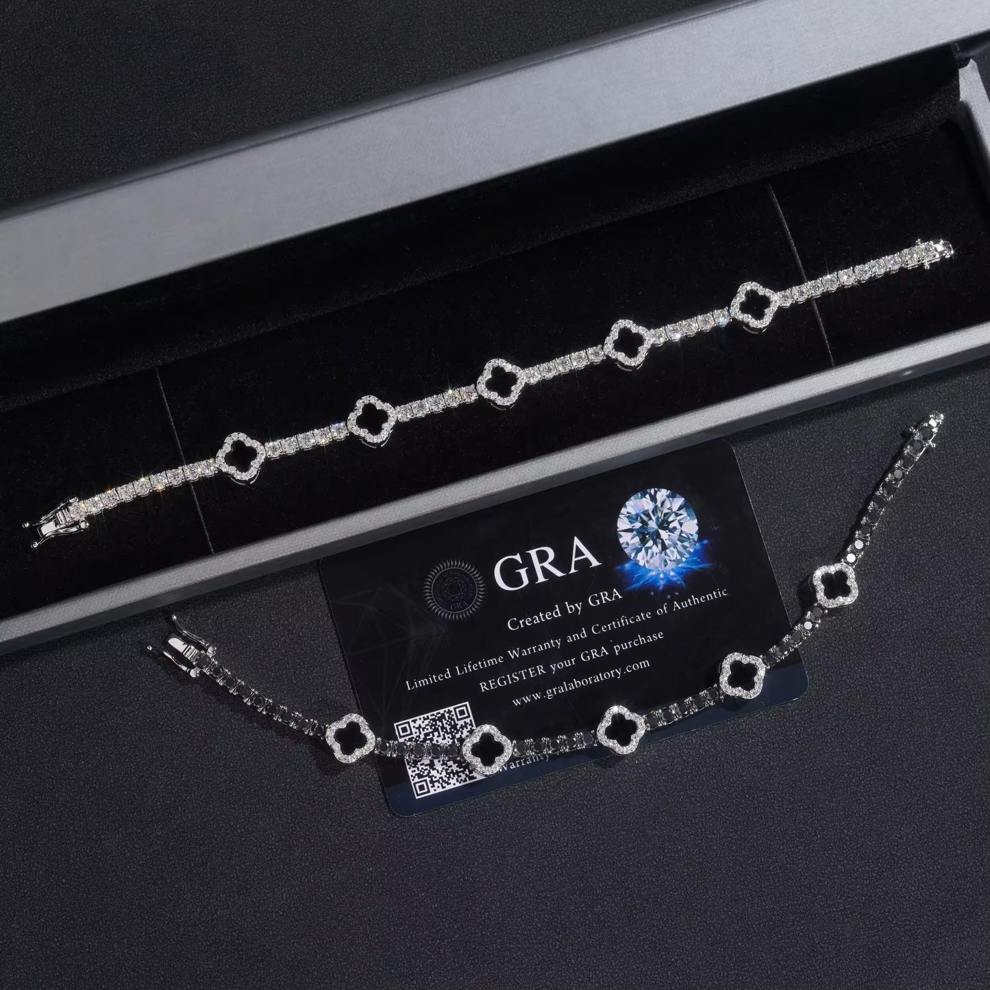 Silver bracelet with GRA branding on a black background