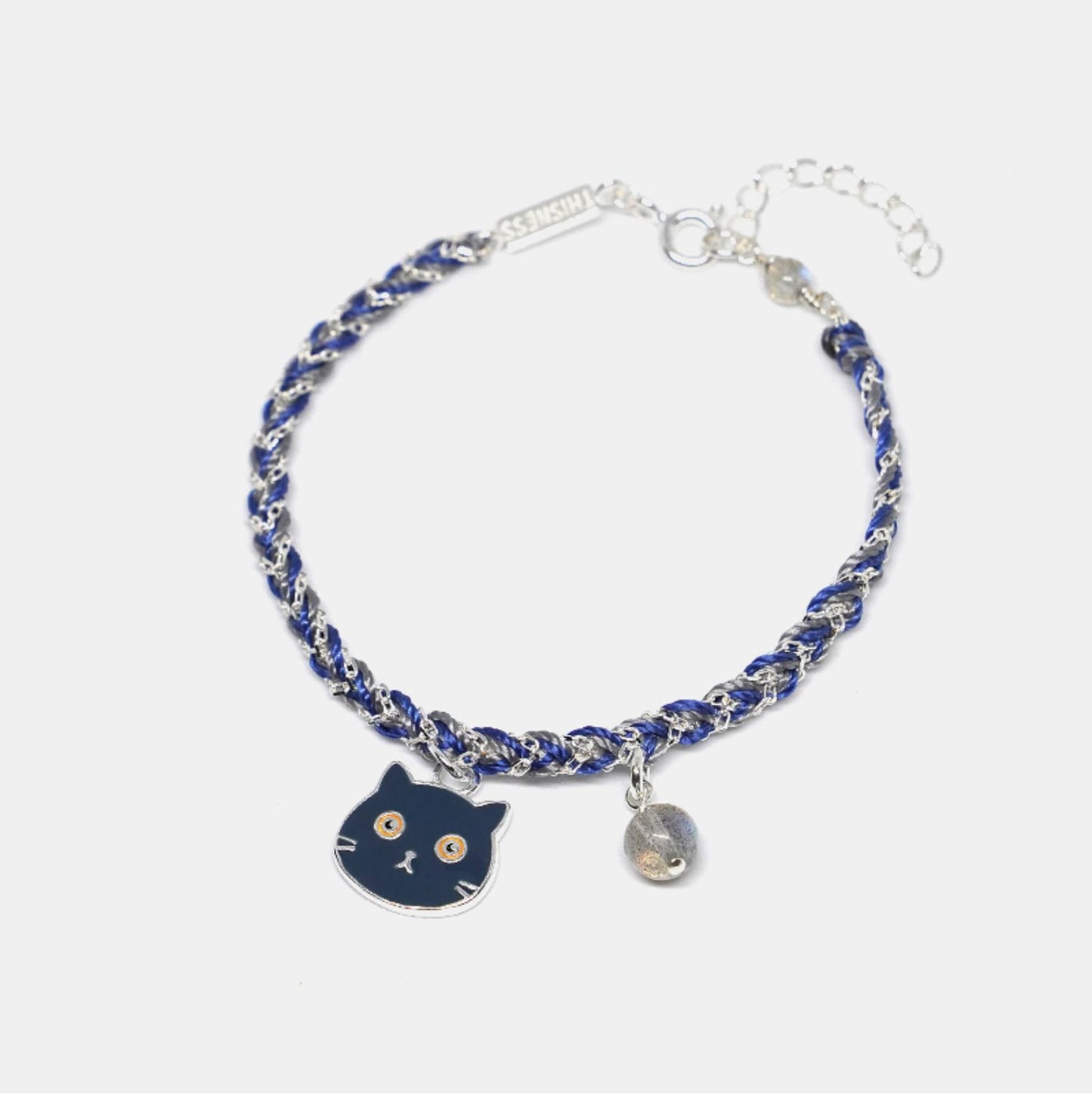 Bracelet with a cat charm on a white background