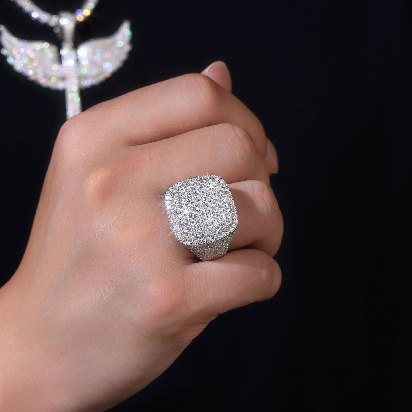 Model with authentic streetwear style (chain, watch, clean sneakers) wearing the ring.