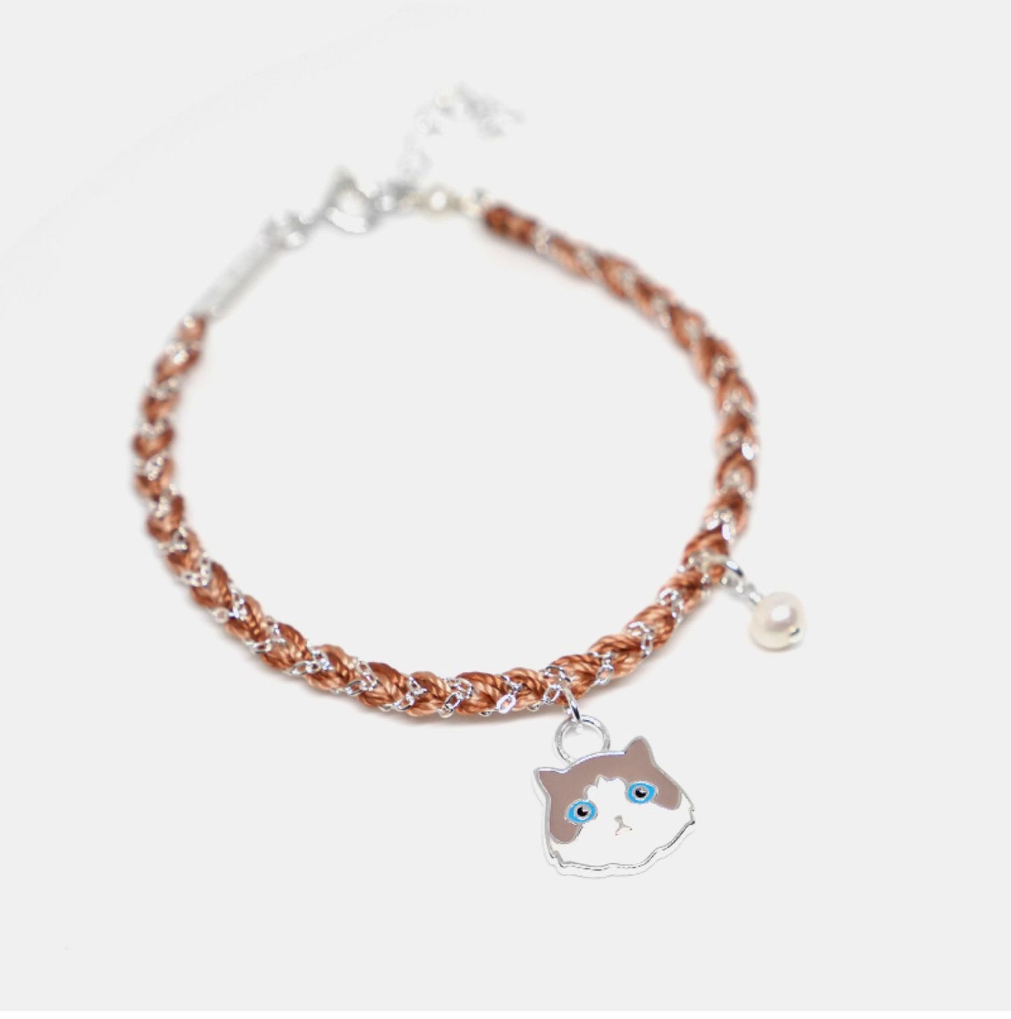 Bracelet with a cat charm on a white background