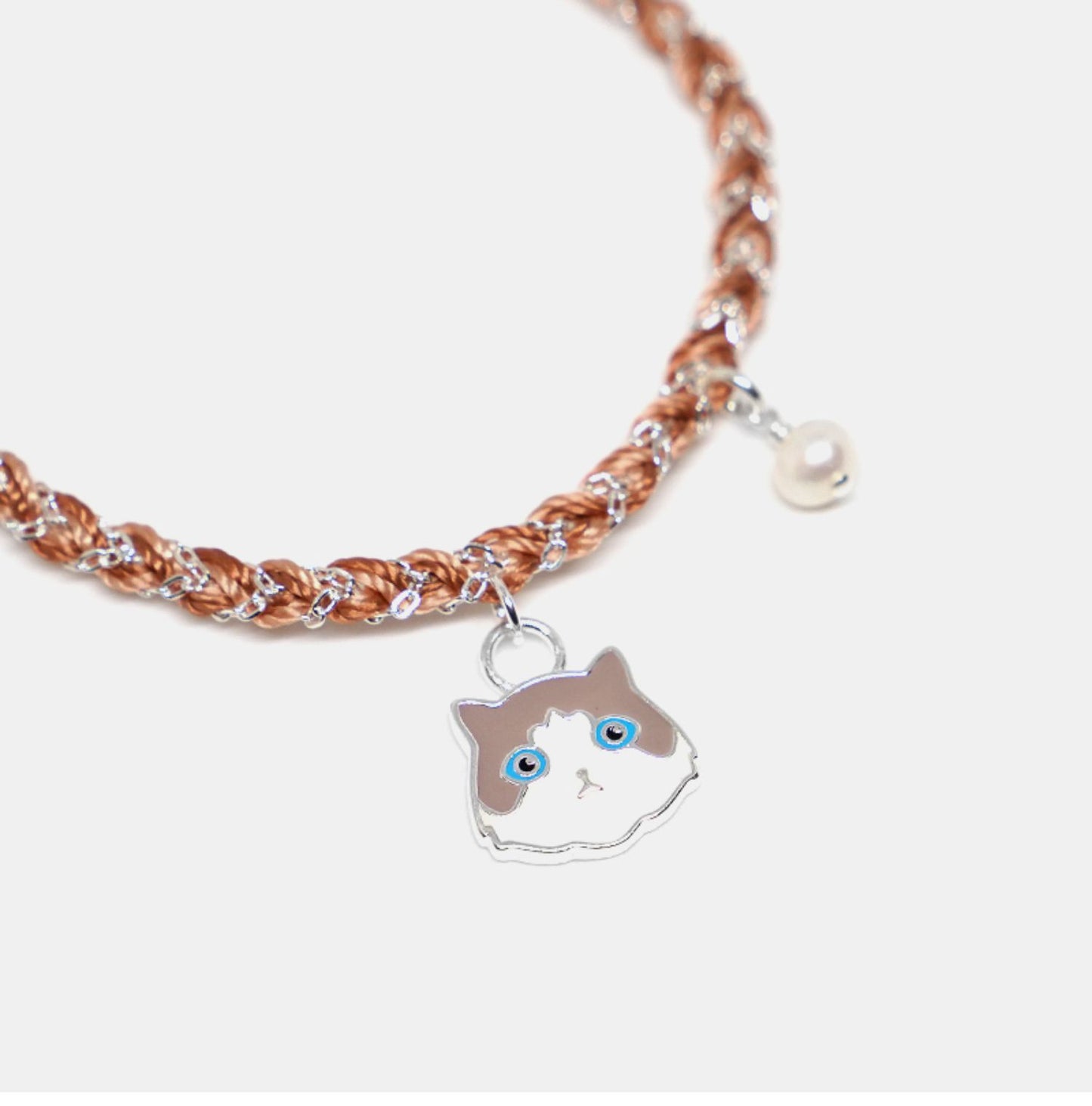 Bracelet with a cat-shaped charm on a white background