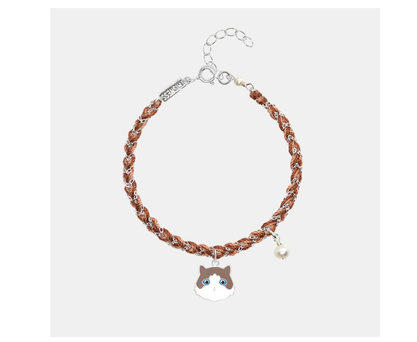 Bracelet with a cat-shaped charm on a white background