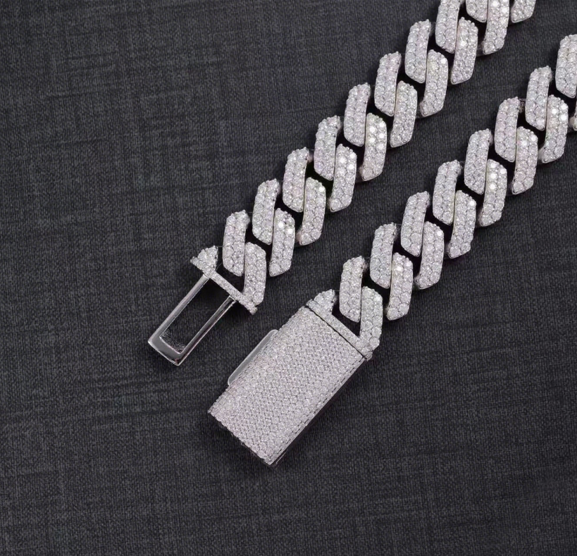 Silver chain belt with a clasp on a dark textured background