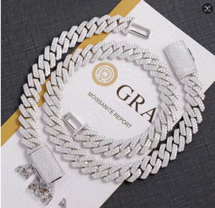 Silver chain necklace with diamond-like stones on a white card displaying 'GRA' branding.