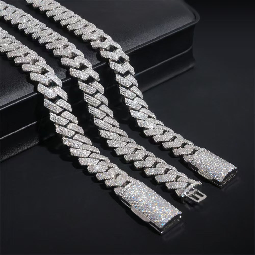 Two silver chain bracelets on a black background