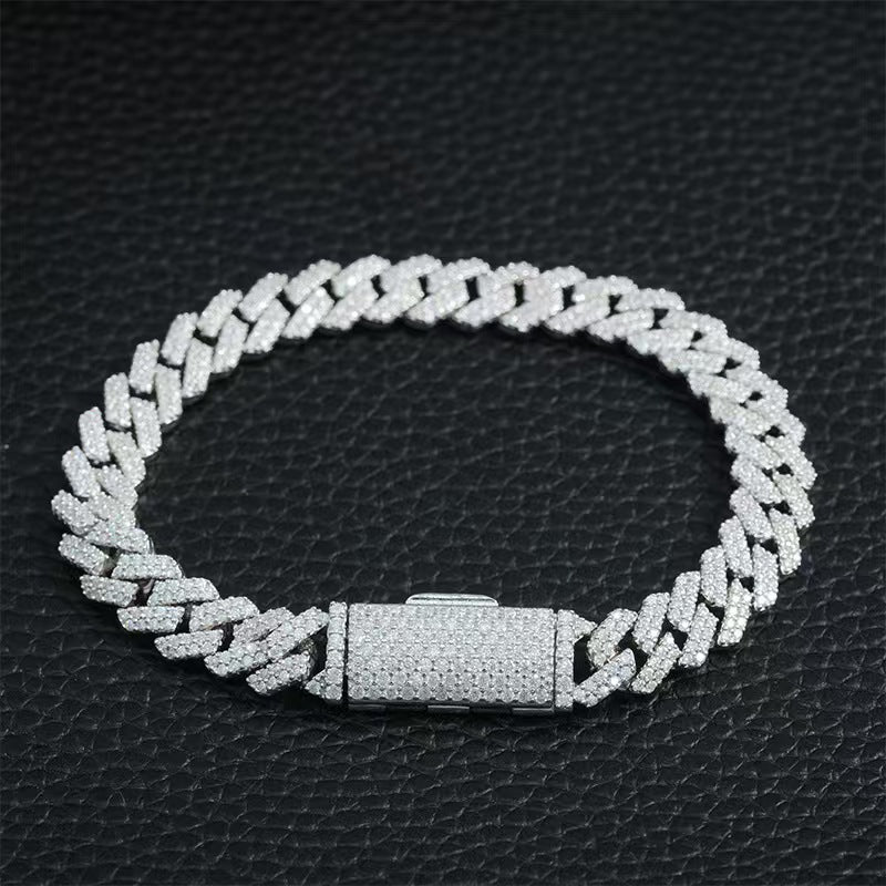 Silver chain bracelet on a black textured background