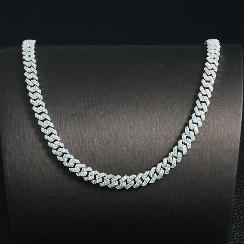 Silver chain necklace on a dark background
