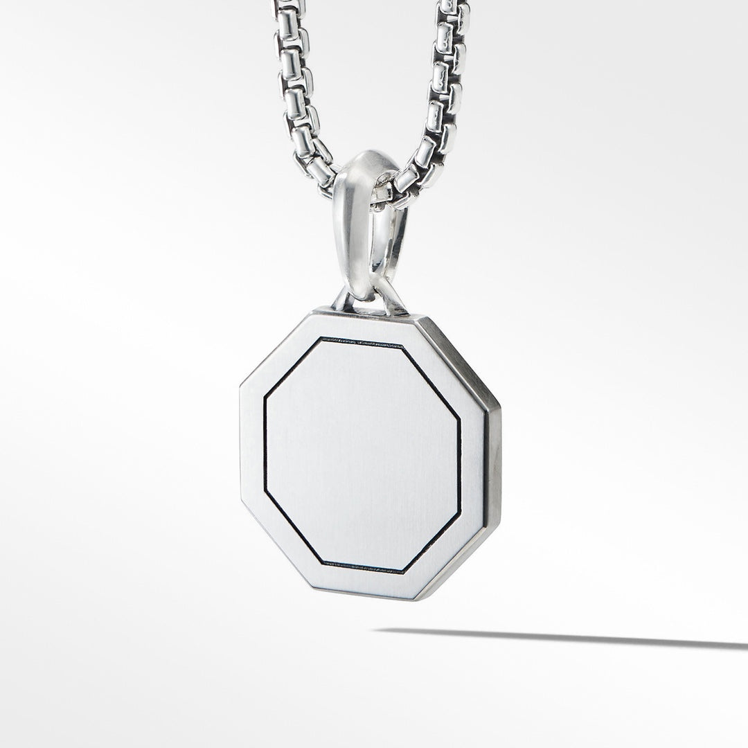 Silver necklace with a hexagonal pendant on a white background