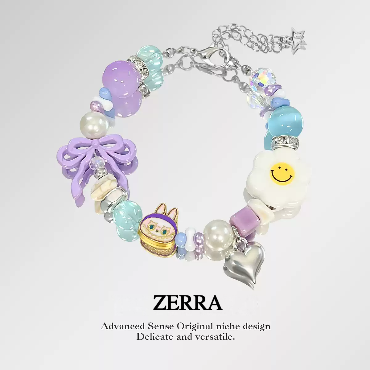 Colorful beaded bracelet with charms on a light gray background, featuring the brand 'Zerra'.