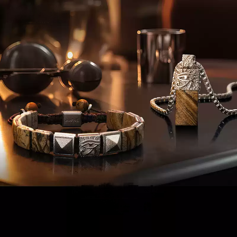 Bracelet and necklace with decorative elements on a dark surface