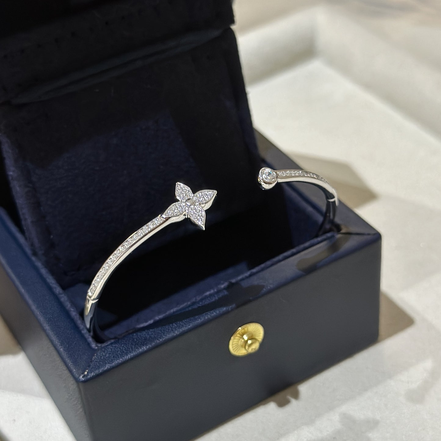 Silver bracelet with star design in a black jewelry box