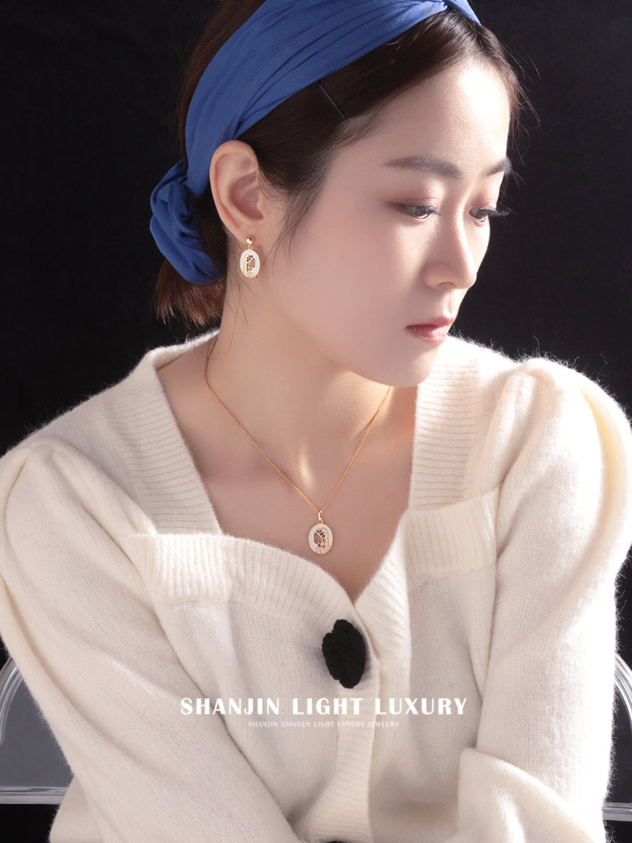 Woman wearing a blue headband and white sweater with jewelry, branded 'SHANJIN LIGHT LUXURY'.