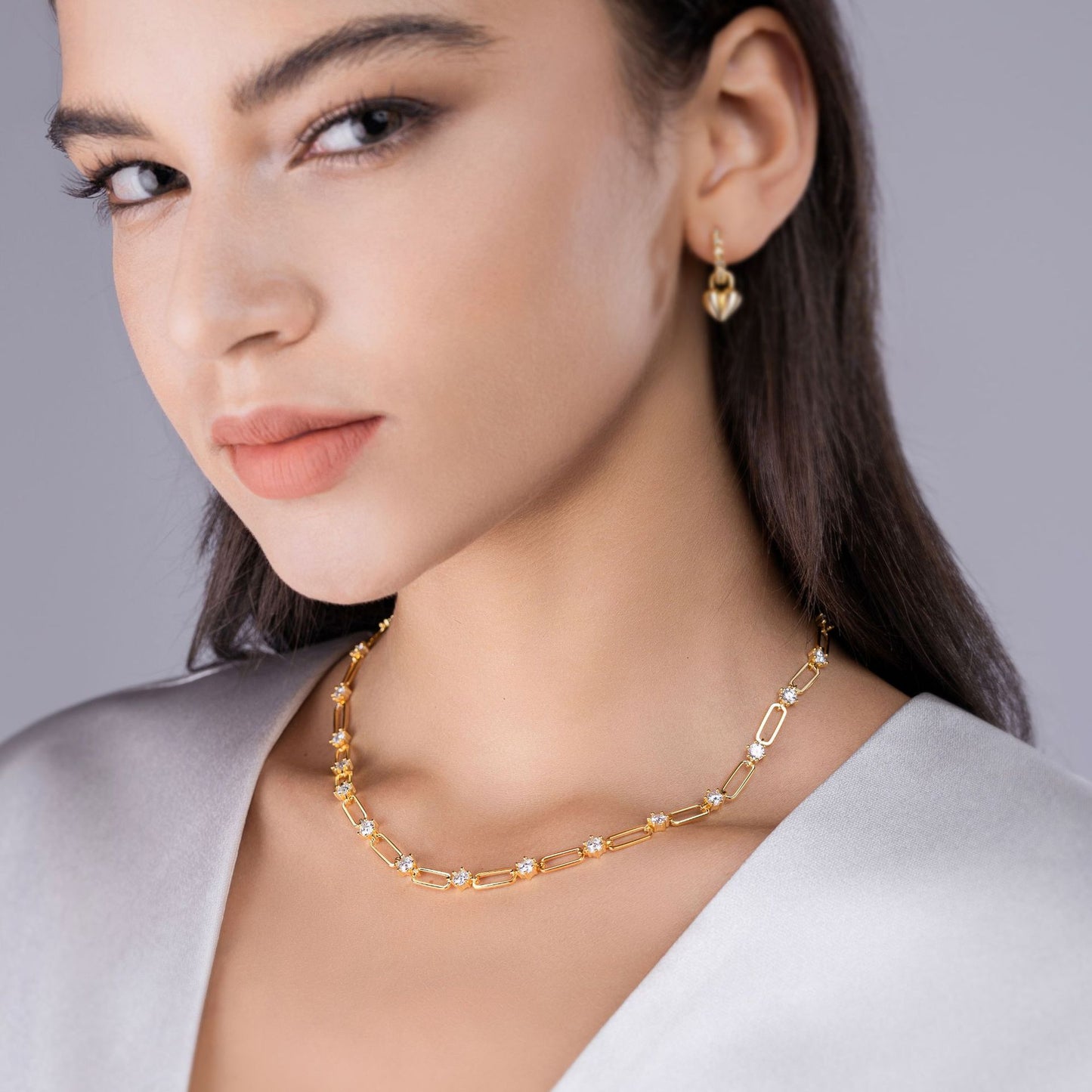 Model wearing the necklace alone on bare skin.