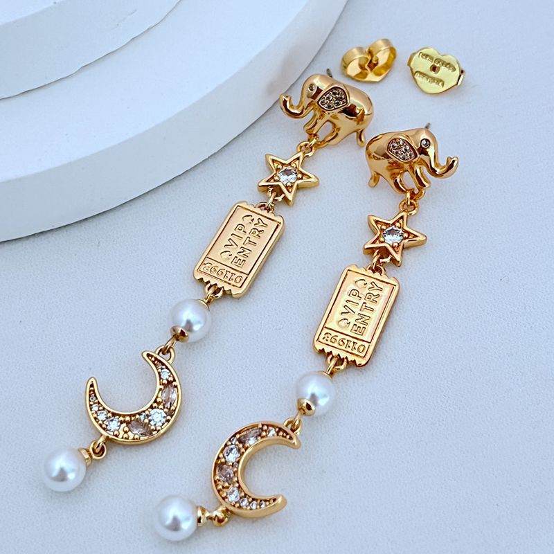 Earrings on soft icy blue or snow-white background. Alt: “KATE SPADE Winter Carnival Charm Earrings – Festive Holiday Jewelry.”