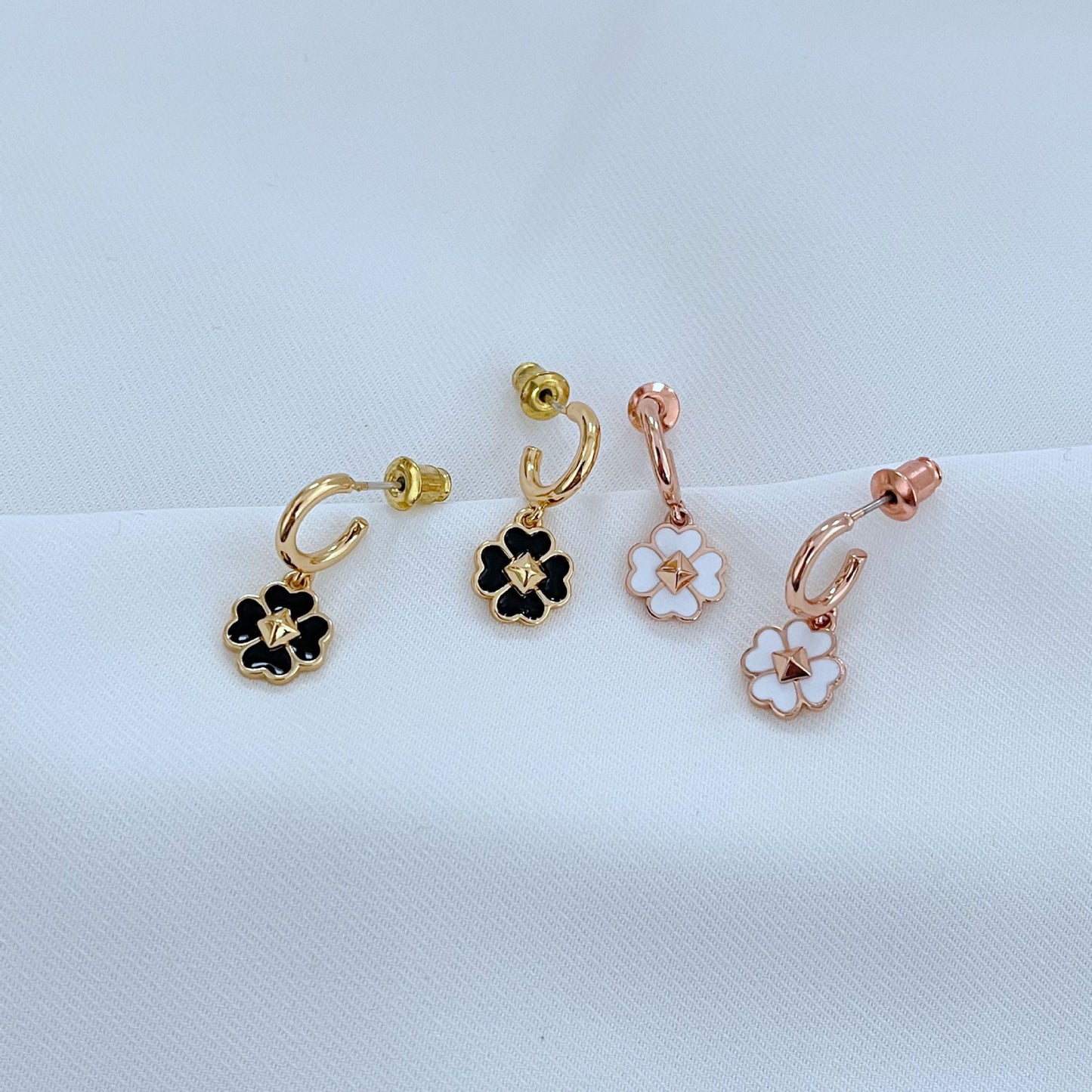 The necklace styled next to a deck of cards, a lucky coin, or on a minimalist surface, reinforcing themes of luck and modern design.
