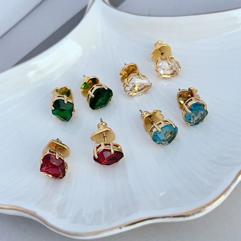 Earrings styled alongside a steaming coffee cup, fresh flowers, and morning sunlight streaming through a window. Alt: “Rise & Shine: Styling the Kate Spade Light Blue Inspirational Earrings.”