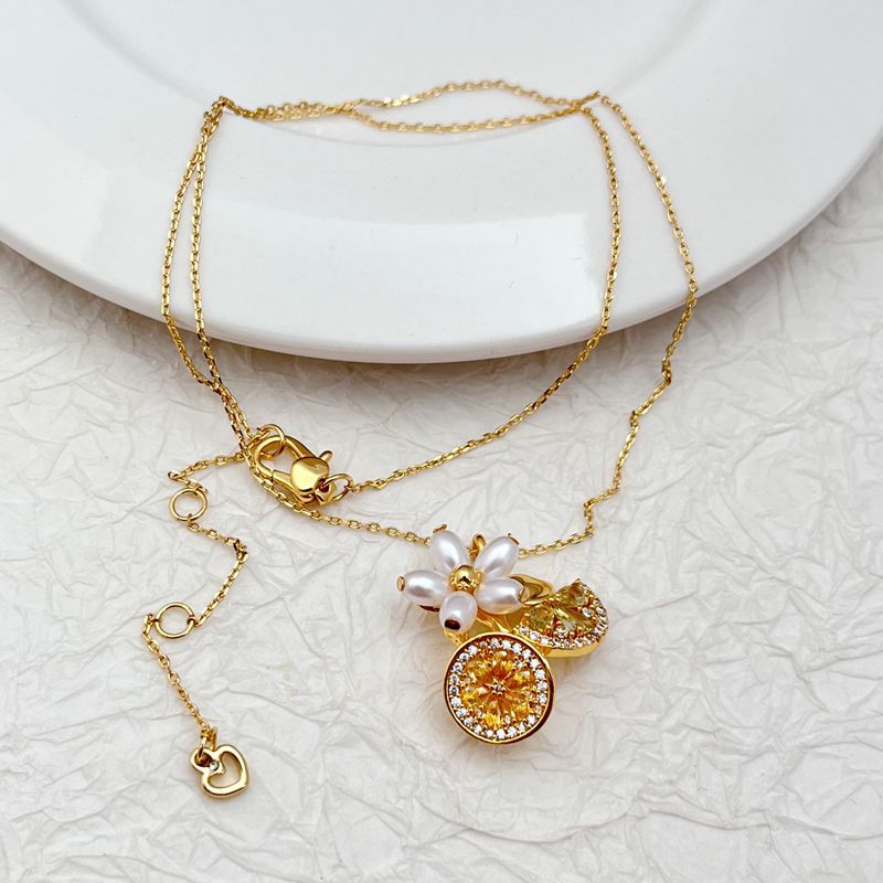 Vibrant, clean shot of the necklace on a light, fresh background (like light green or yellow), highlighting the colorful charms.