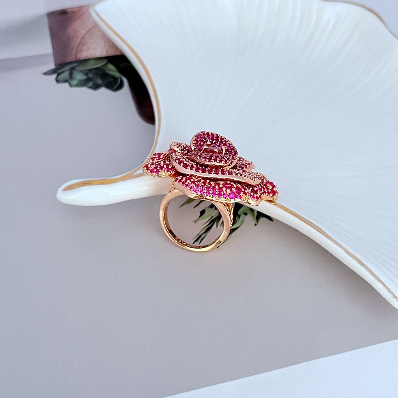Ring on soft blush or velvet background. Alt: “Kate Spade Rosy Statement Ring – Pink Enamel Flower Jewelry.”