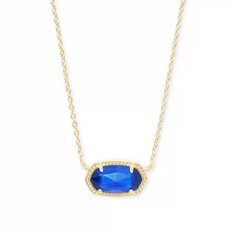 Gold necklace with a blue pendant on a white background