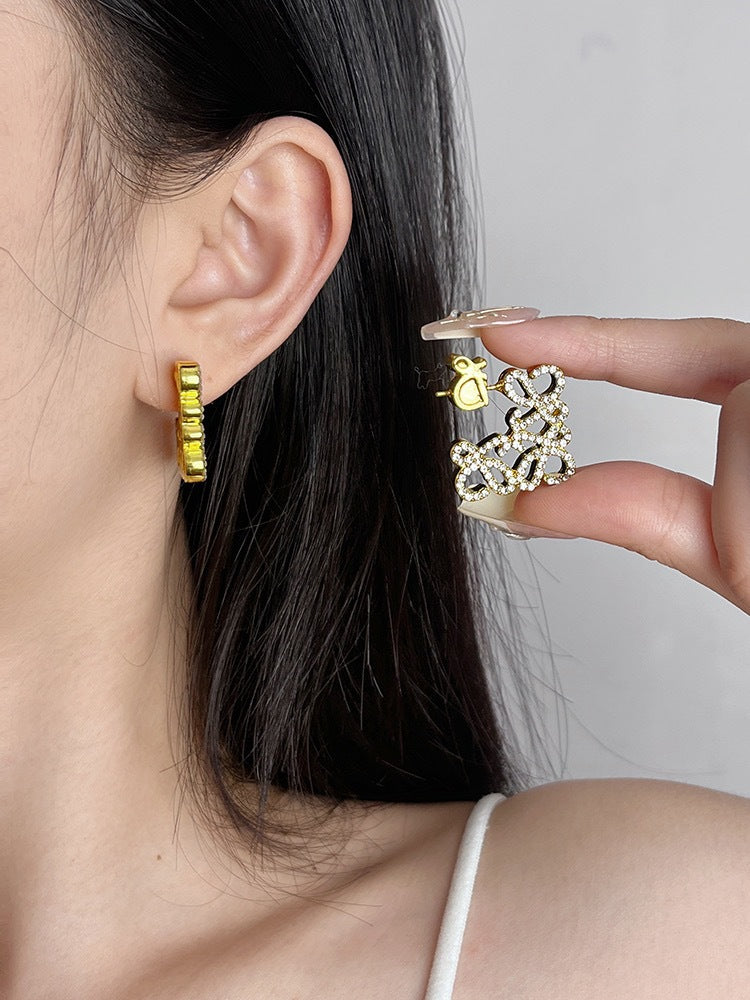 Close-up of the earrings being worn, focusing on how they frame the face with subtle elegance.