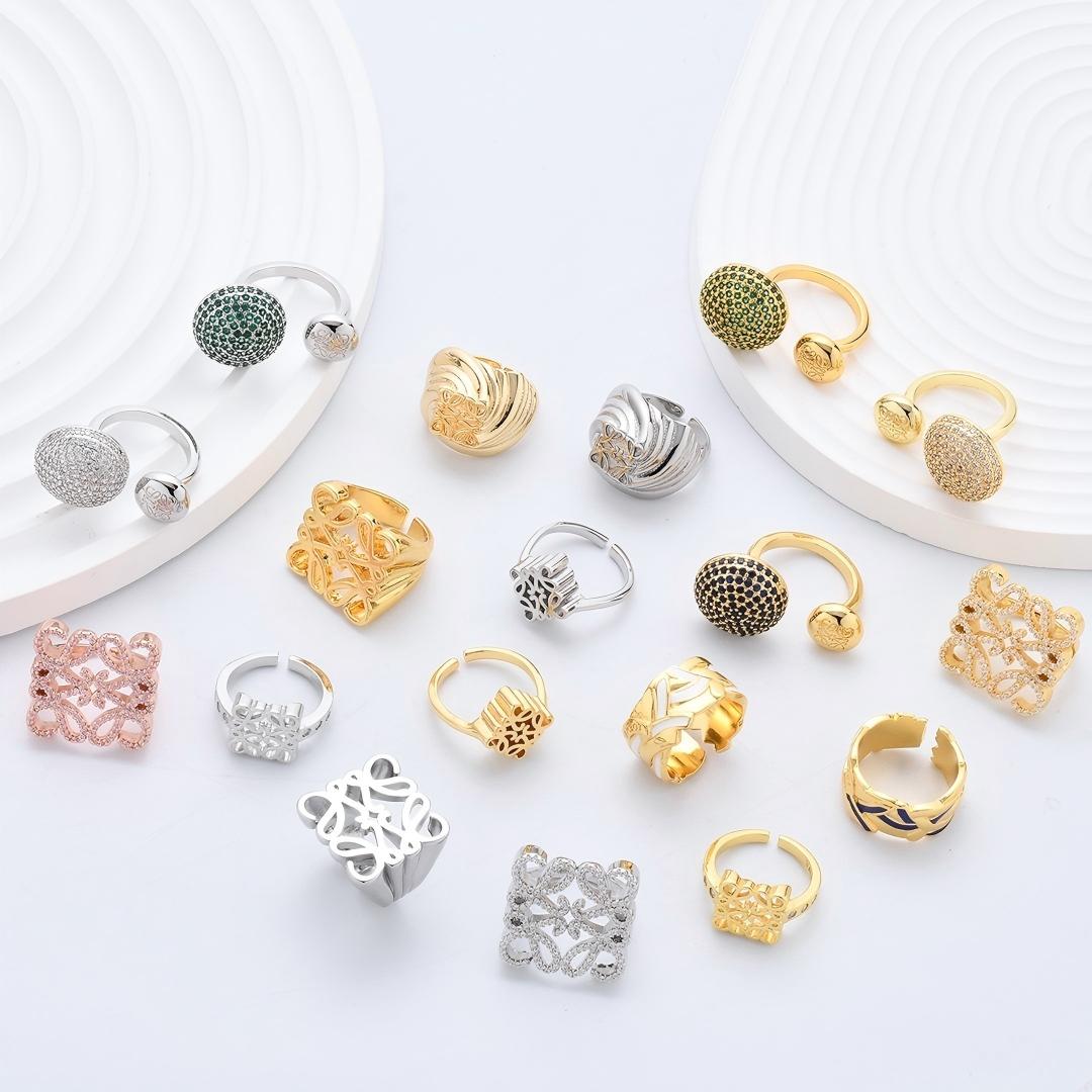 Clean, angled shot of the ring on a finger or stand, showcasing the square silhouette and intricate hollow pattern against a solid background.