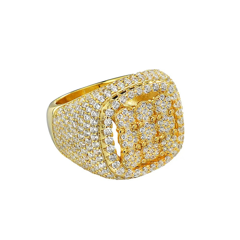 Gold ring with diamond accents on a white background