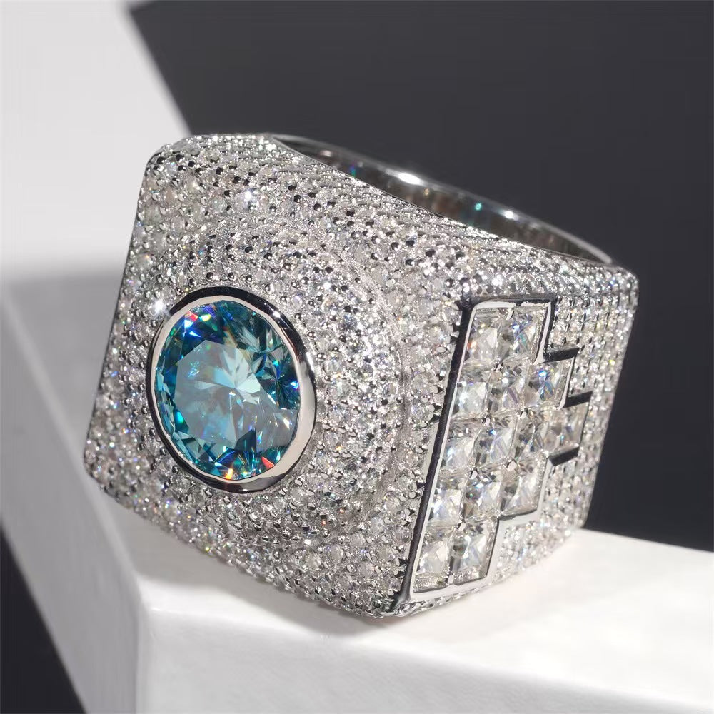 Luxury ring with a large blue gemstone and sparkling silver setting on a dark background