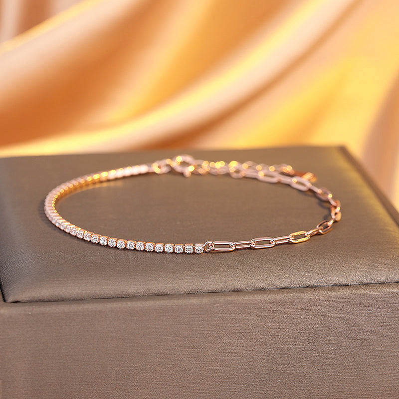 Rose gold bracelet with diamonds on a gray box with a gold fabric background