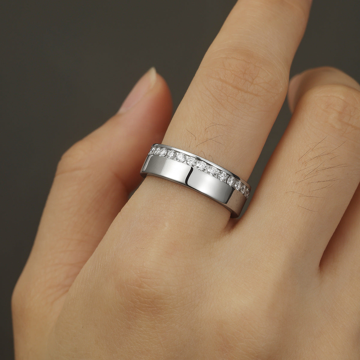 Side-by-side flat lay featuring masculine and feminine ring styles on a neutral backdrop. Alt: “Men and Women's Moissanite Eternity & Engagement Rings – Unisex Collection.”