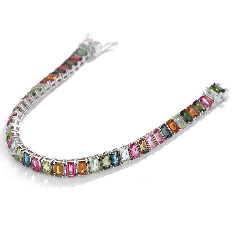 Focus on the color variation, facet brilliance, and the precision of the stone settings.
