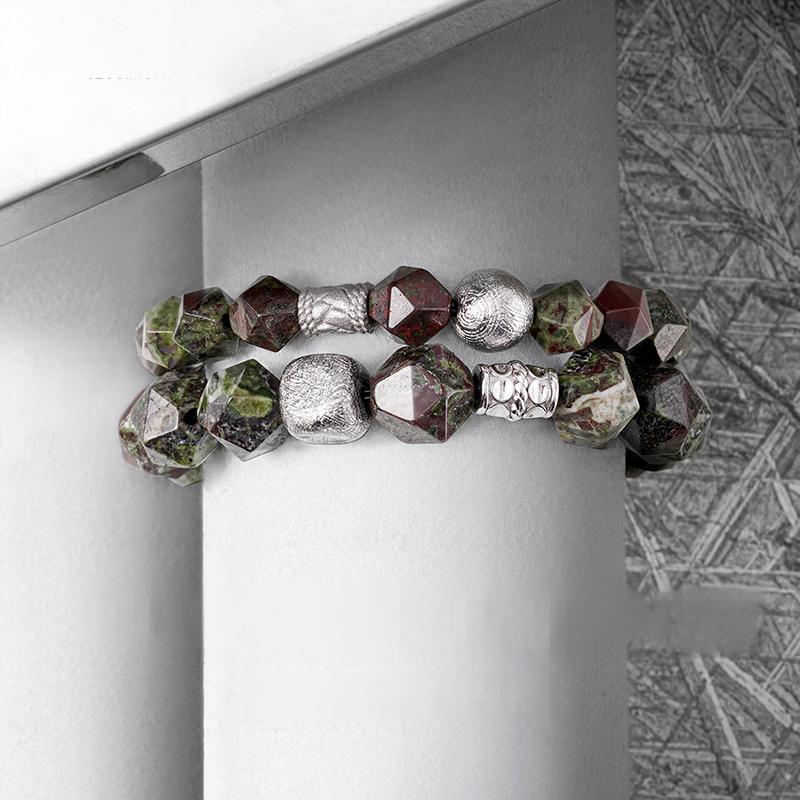 Bracelet with geometric beads on a white surface