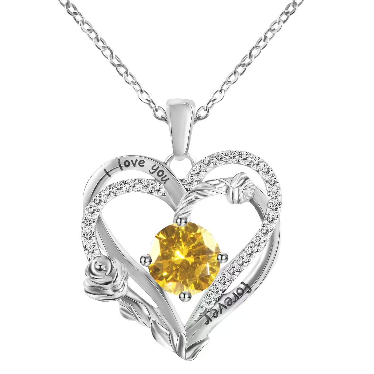 Heart-shaped silver pendant with yellow gemstone and 'I love you' engraving on a white background