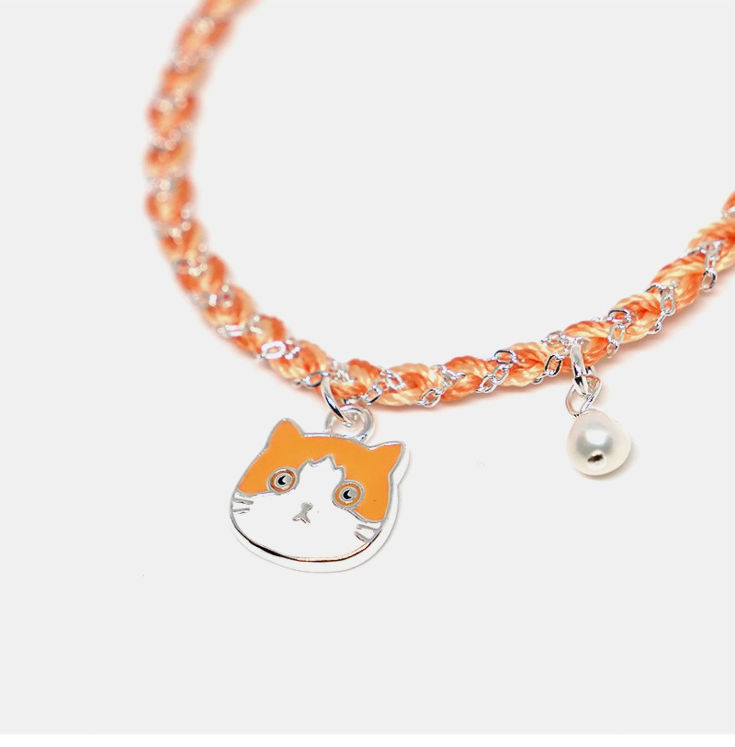 Bracelet with fox charm and pearl on a white background