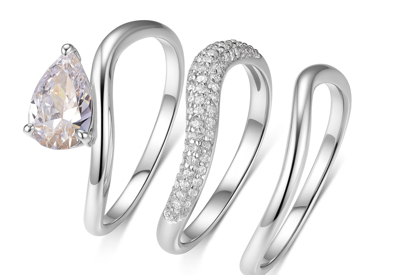 Yellow gold pear bridal set on neutral/romantic background. Alt: “Pear Moissanite Engagement Ring Set – 18K Yellow Gold.”