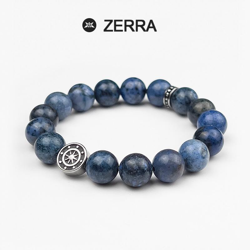 Blue beaded bracelet with silver accents on a white background, featuring the Zerra brand.