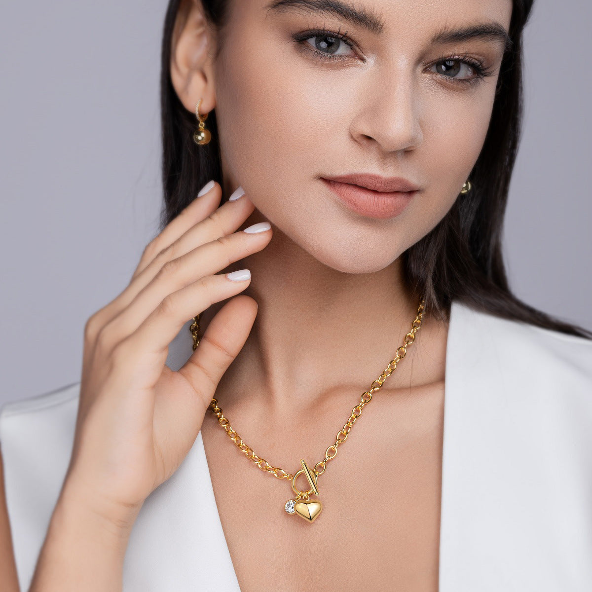 Model wearing the necklace in a soft, romantic setting (soft lighting, roses, sunset).