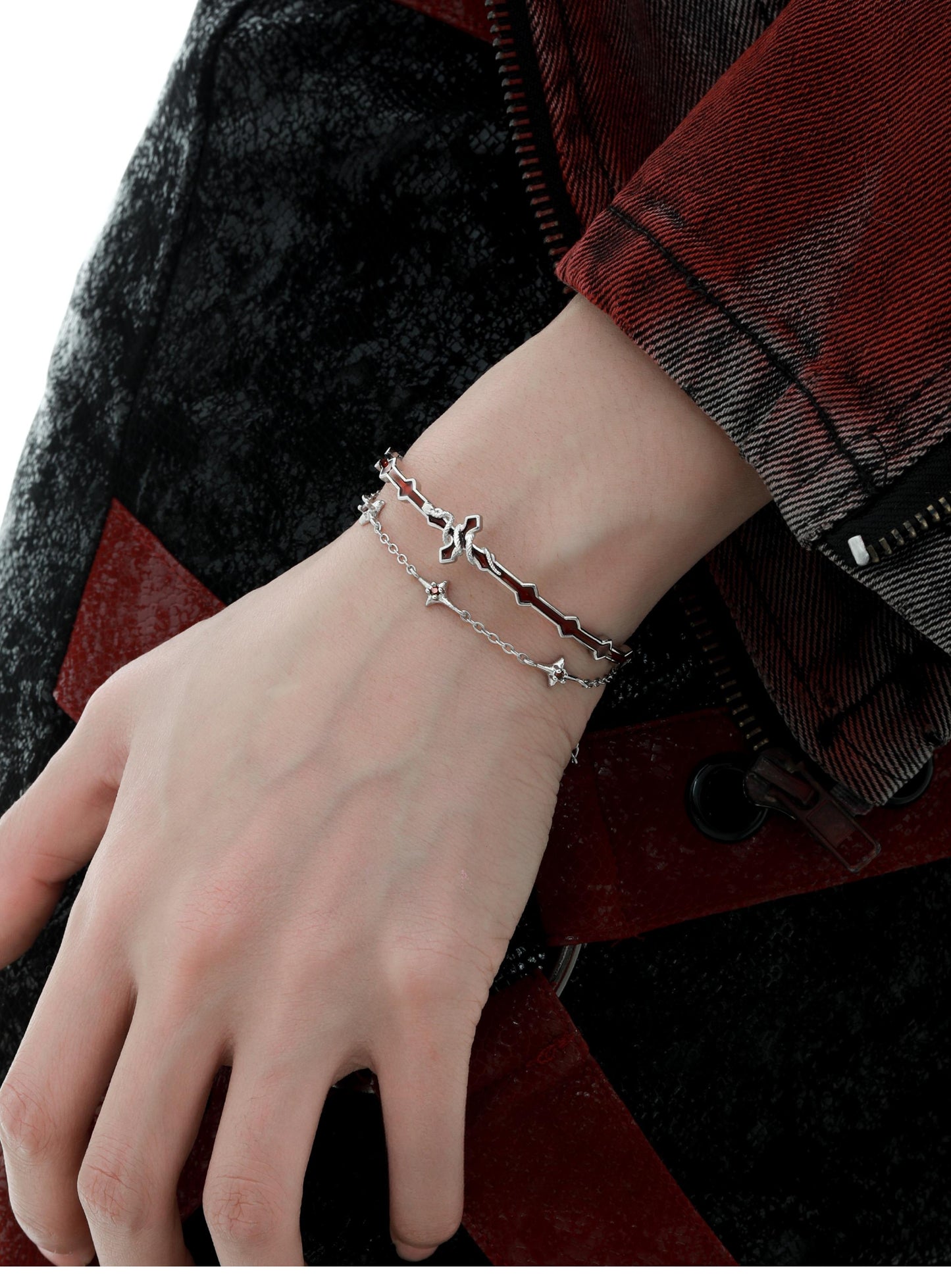 "Male model wearing serpent-inspired sterling silver bangle in minimalist style"