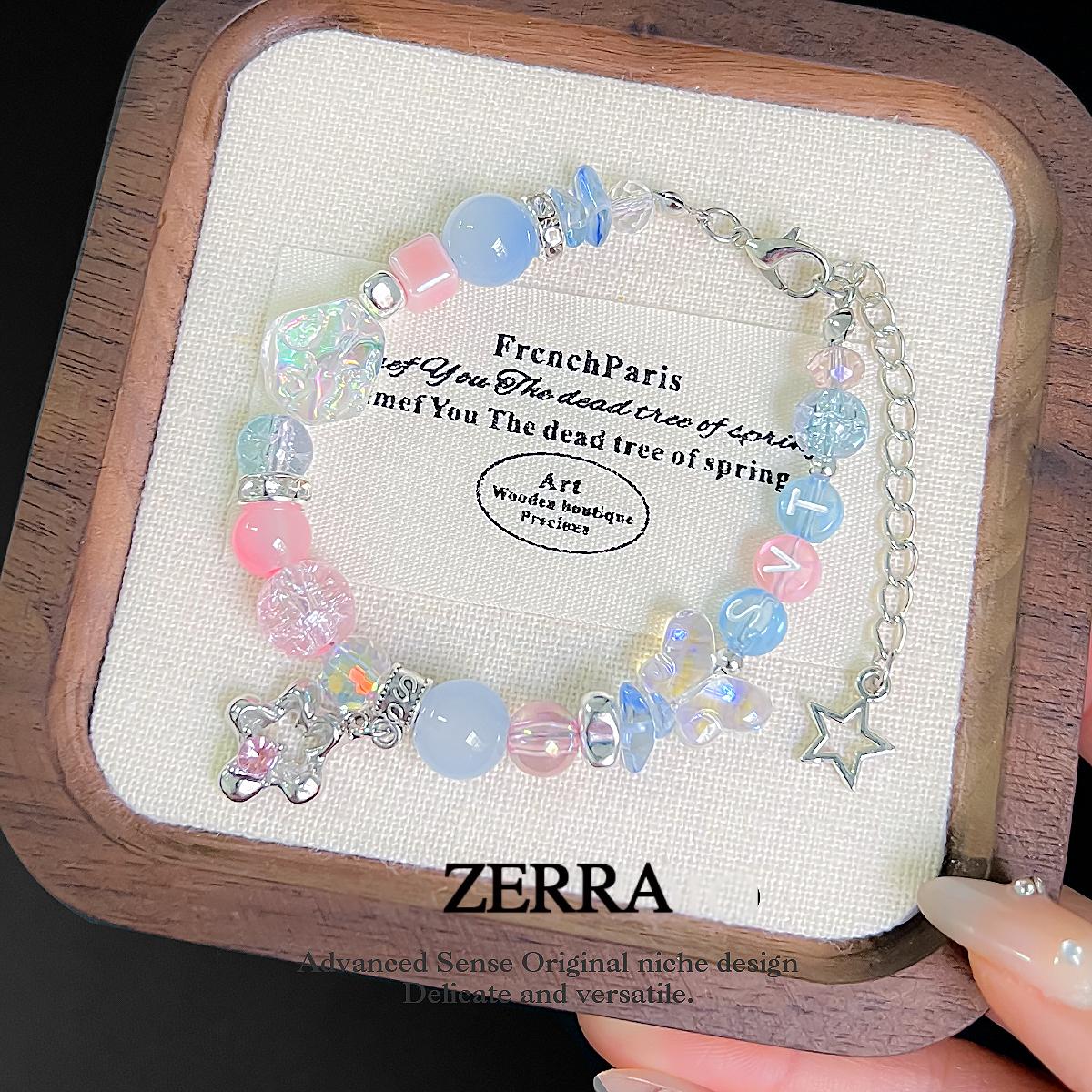 Bracelet with colorful beads and charms on a Zerra branded card