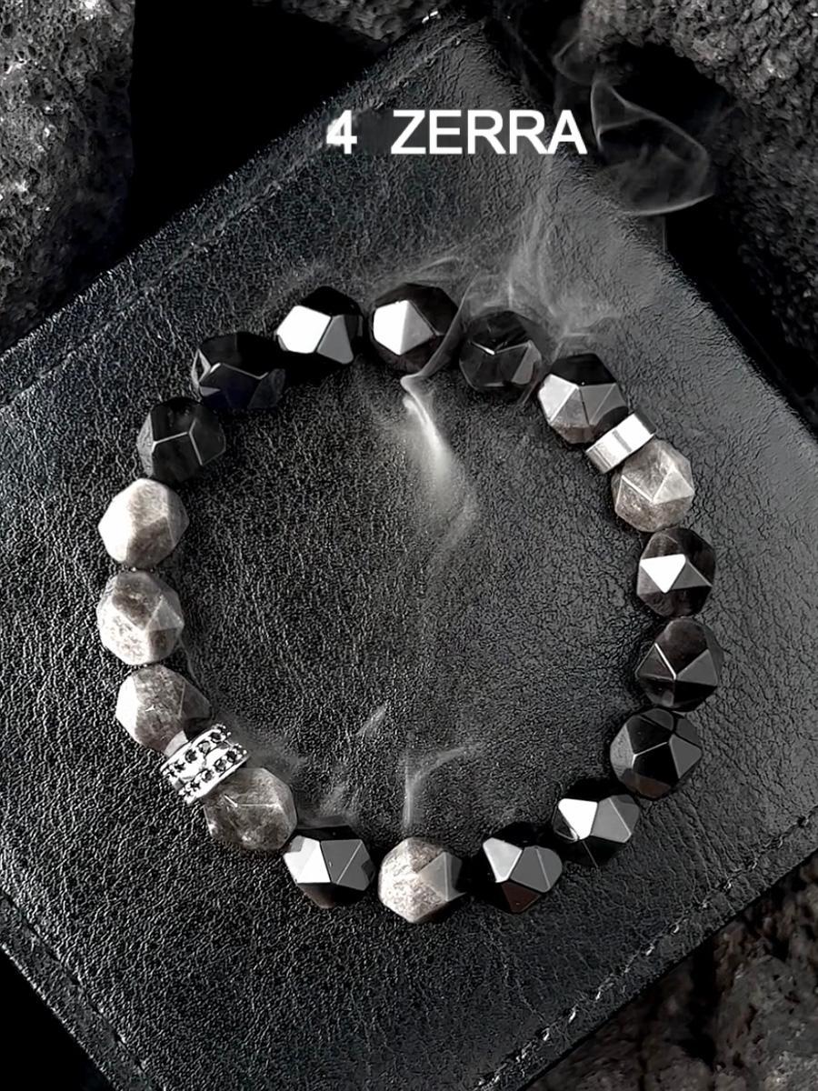 Bracelet with geometric beads on a textured surface, featuring the brand 'Zerra'.